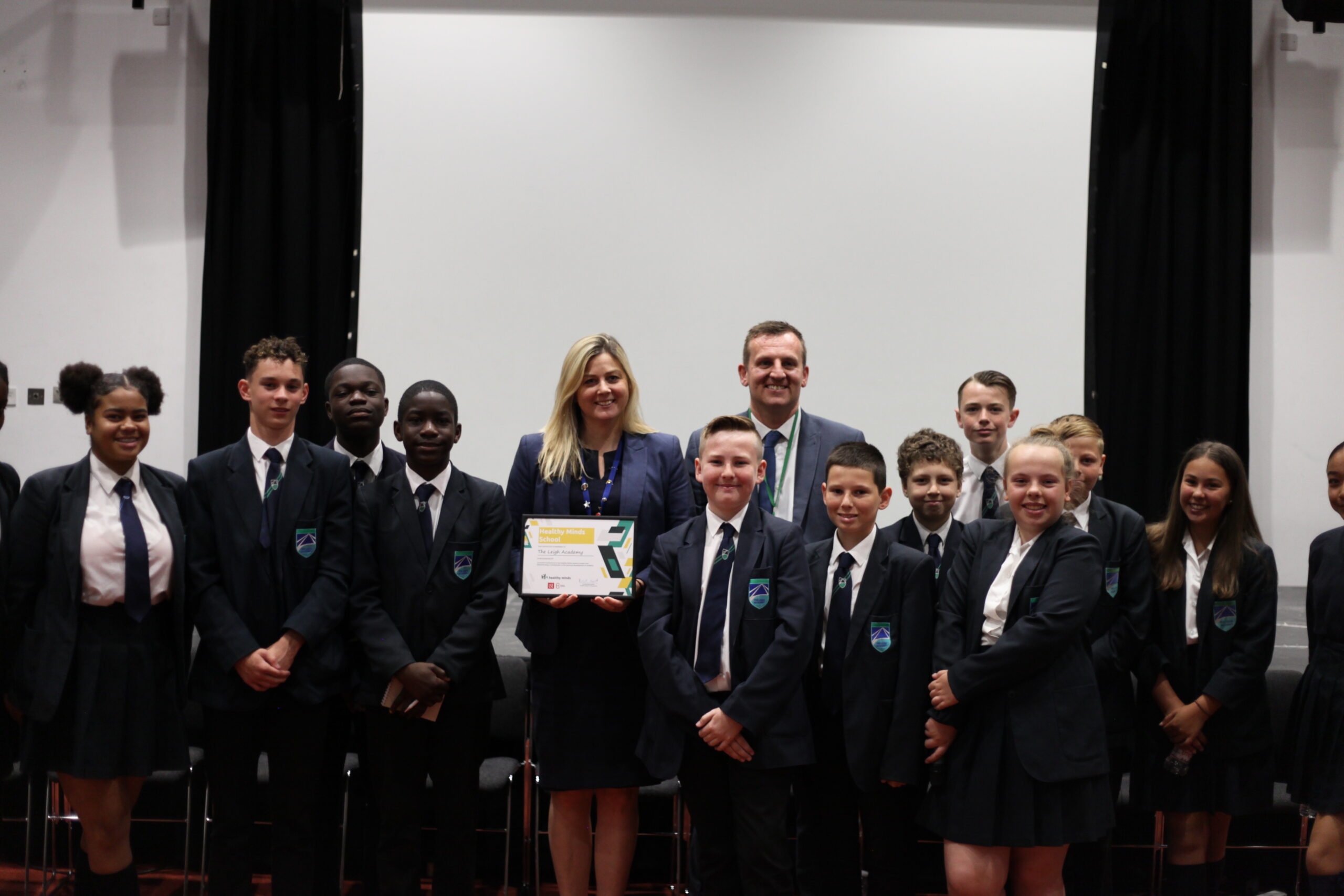 Staff and students at The Leigh Academy receiving the Healthy Minds Kitemark